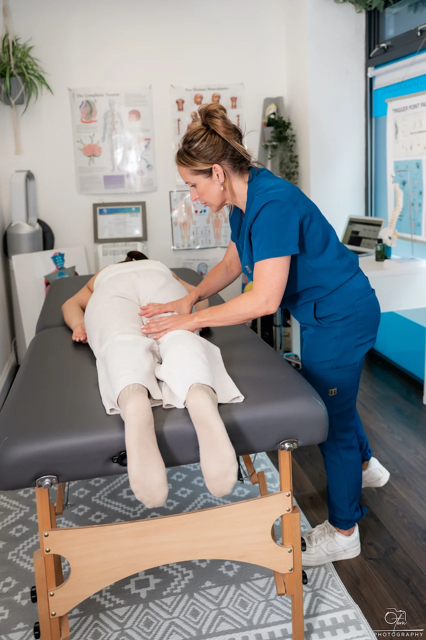 IMG_2789 Mel Kingdom performing Bowen therapy on a client's knees and legs